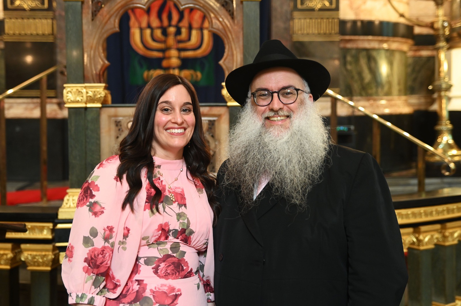 Rebbetzen Miriam Lipsey and Rabbi Aaron Lipsey inside the New West End Synagogue